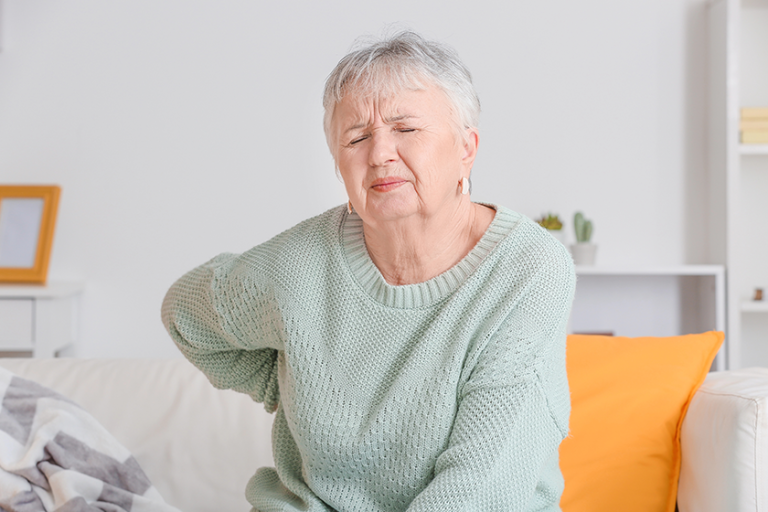 senior woman suffering from back pain