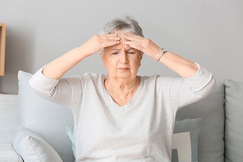 Senior woman suffering from headache at home senior woman suffering from headache at home
