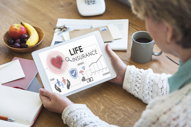 woman holding digital tablet