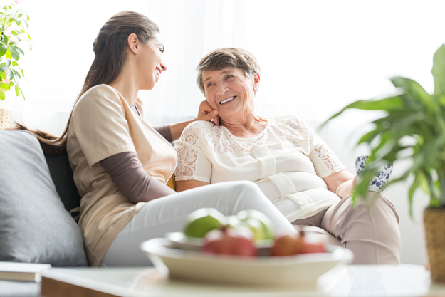 woman talking with elderly mother woman talking with elderly mother