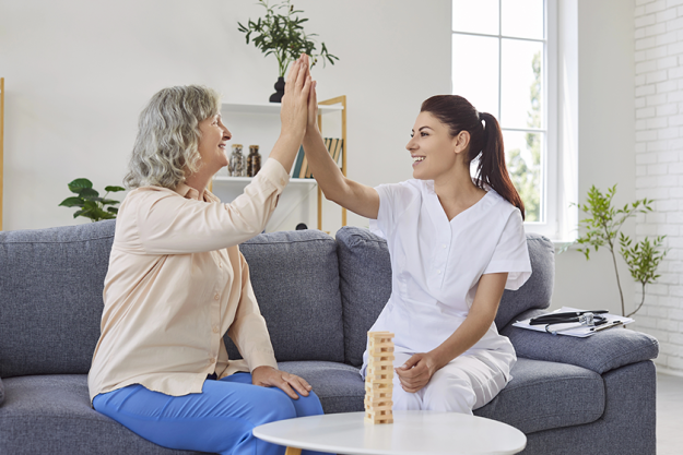 young nurse woman giving high five