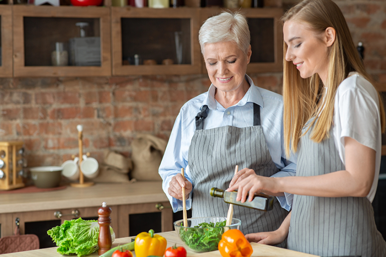 young woman adding olive oil