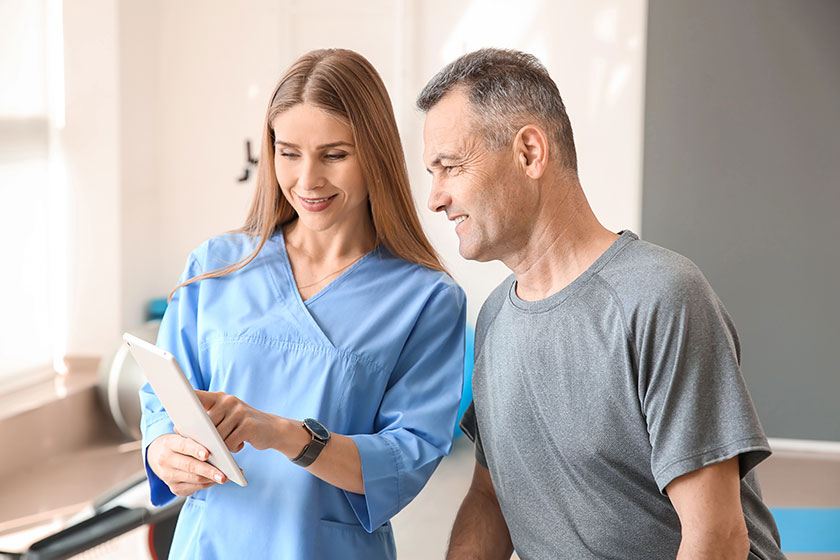 Physiotherapist working with mature patient in rehabilitation center Physiotherapist working with mature patient in rehabilitation center