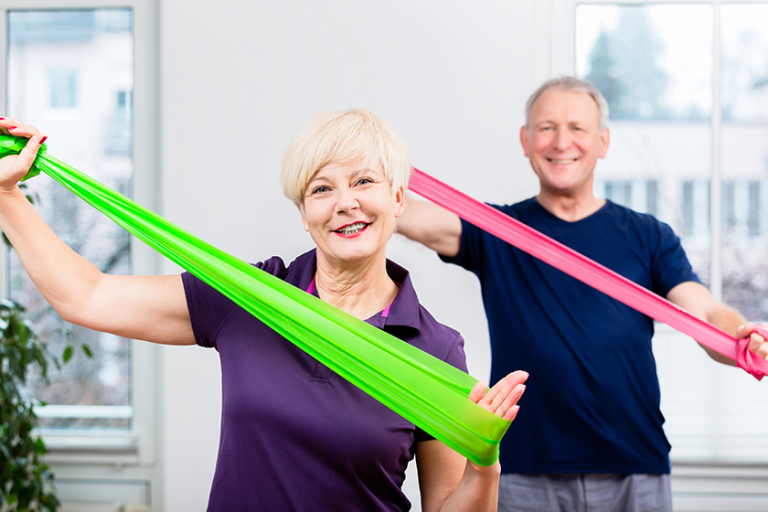 elderly couple in senior gymnastic class elderly couple in senior gymnastic class
