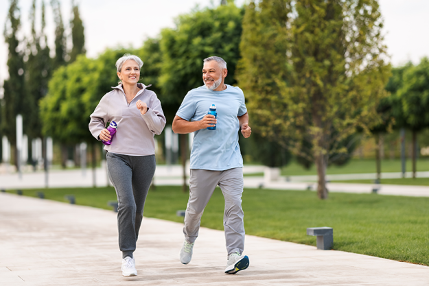 full length photo lovely joyful retirees couple jogging full length photo lovely joyful retirees couple jogging