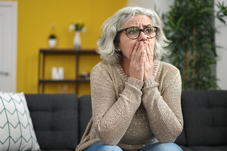 middle age woman grey hair stressed