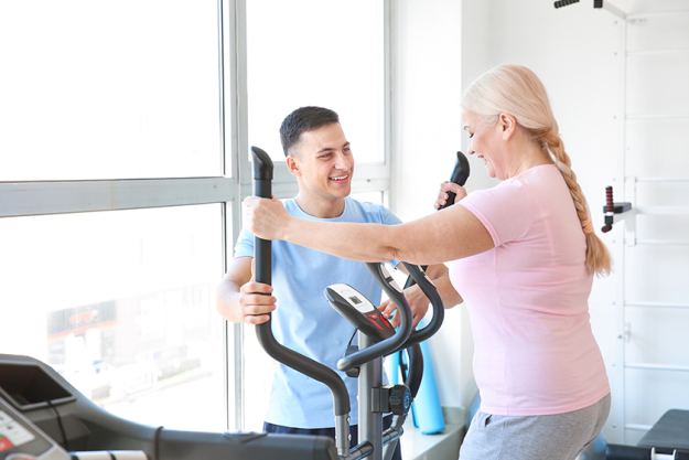 physiotherapist working with mature patient physiotherapist working with mature patient