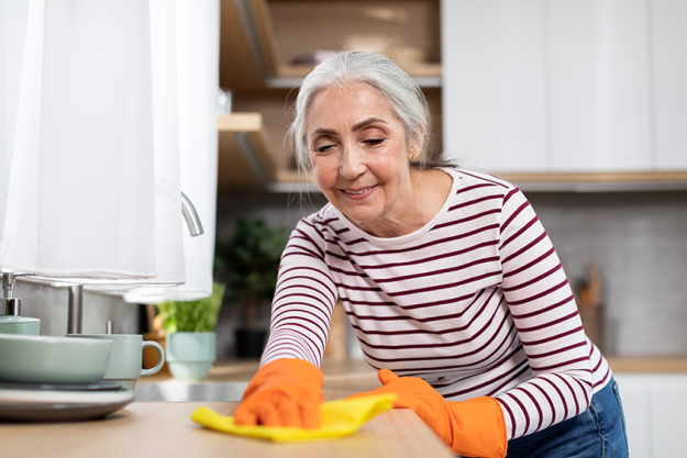 portrait beautiful senior housewife washing table portrait beautiful senior housewife washing table