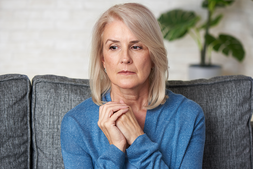 sad senior woman sitting sofa home old blonde lady sad senior woman sitting sofa home old blonde lady
