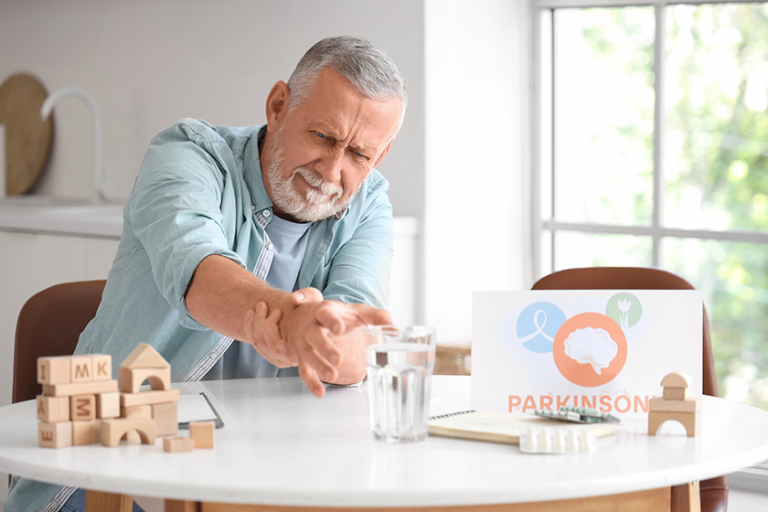 senior man suffering parkinson syndrome