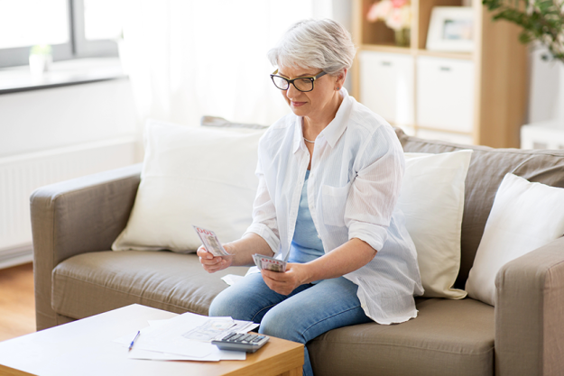 senior woman counting money