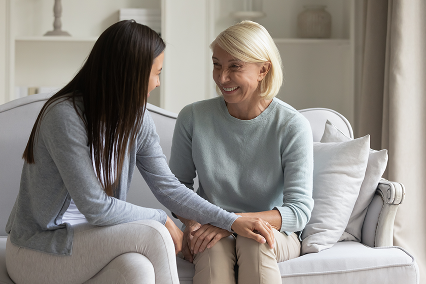 smiling adult mom and daughter talking smiling adult mom and daughter talking