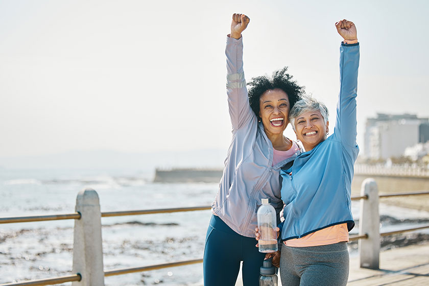 Success women friends fist pump fitness goals running outdoor winning Success women friends fist pump fitness goals running outdoor winning