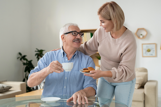 young careful daughter bringing some cookies young careful daughter bringing some cookies