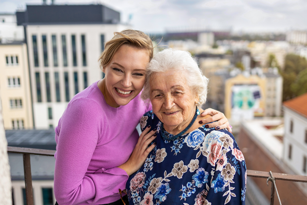 young woman spending time her elderly grandmother young woman spending time her elderly grandmother