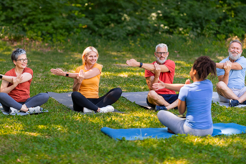 enthusiastic group seniors yoga instructors movements