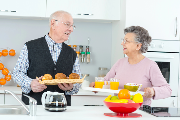 happy old couple having coffee together happy old couple having coffee together