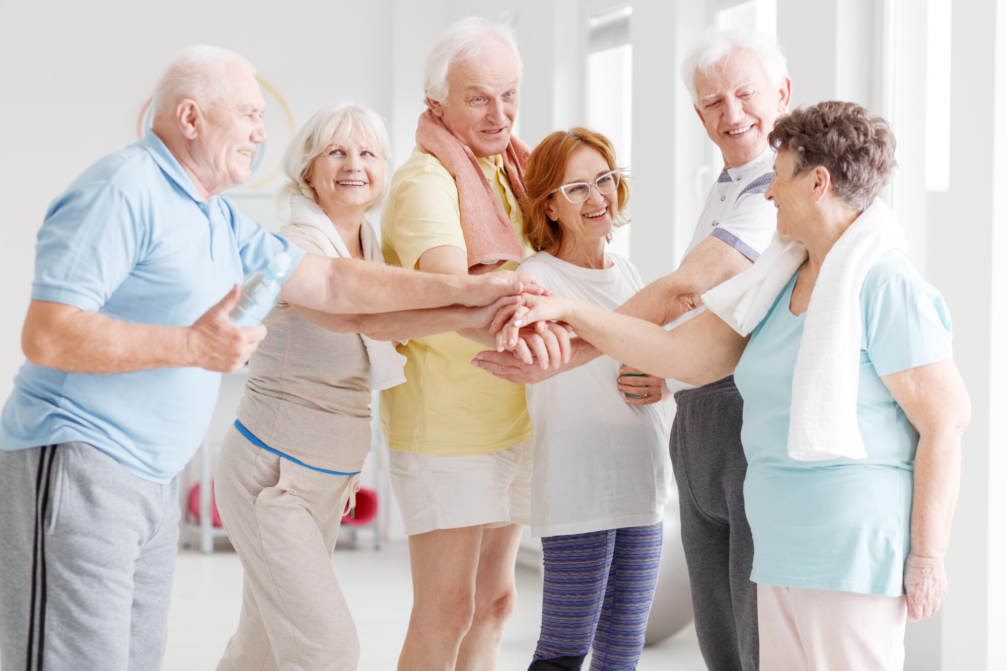 Team,Of,Happy,Active,Seniors,Gathering,Hands,Together,Before,The Team,Of,Happy,Active,Seniors,Gathering,Hands,Together,Before,The