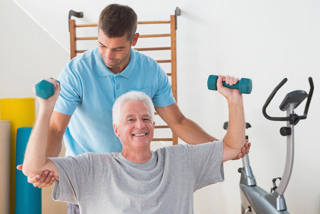 senior man working out with his trainer