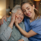 caring healthcare worker visiting senior patient