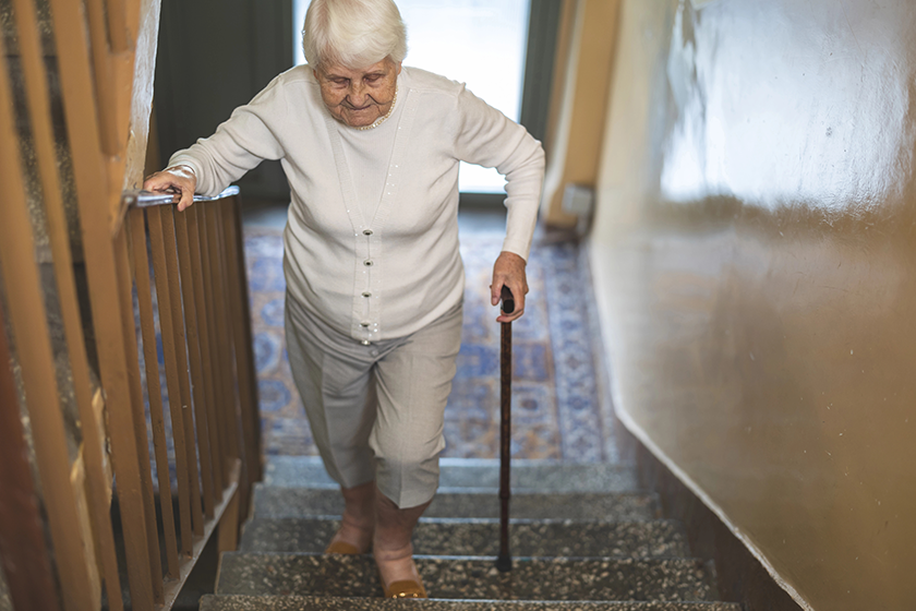 elderly woman walking stairs elderly woman walking stairs