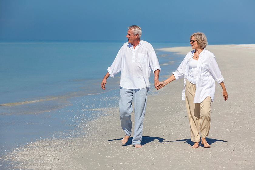 happy senior couple walking holding hands happy senior couple walking holding hands
