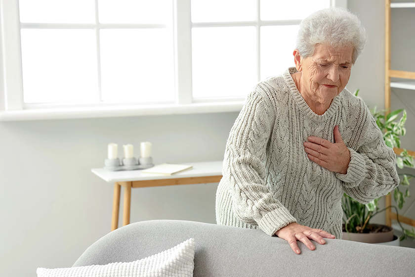senior woman having heart attack