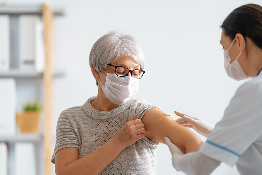 senior woman vaccination her doctor senior woman vaccination her doctor