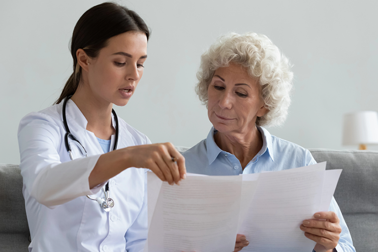 serious young doctor explain insurance contract