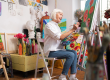 aged artist feeling truly satisfied