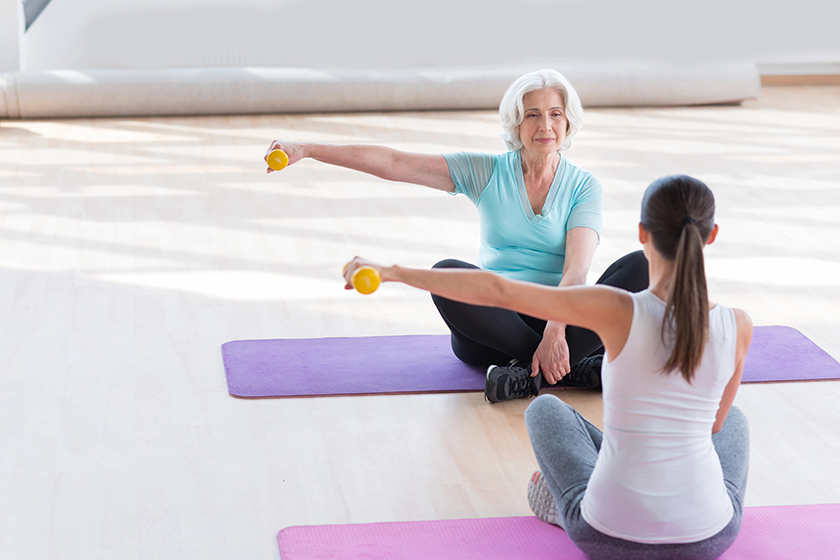 calm elderly woman exercising calm elderly woman exercising