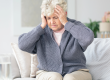 elderly woman having migraine