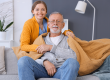 female caregiver covering senior man
