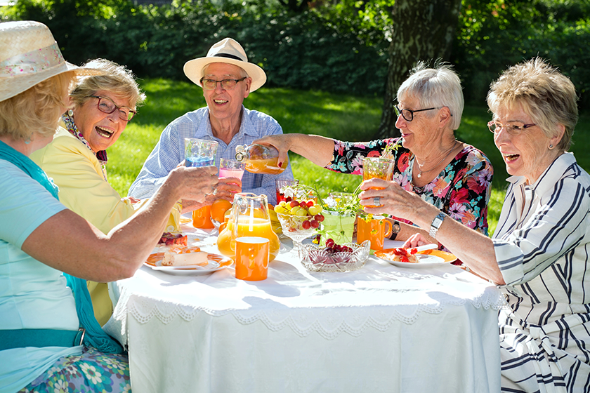 happy elderly people sitting table eating happy elderly people sitting table eating