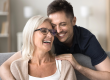 happy son man hugging positive excited mature mom