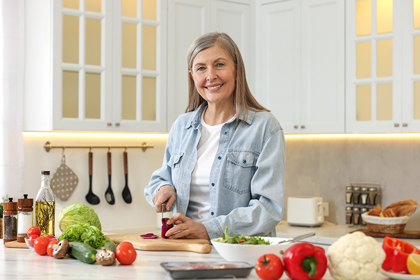 happy woman cutting onion happy woman cutting onion