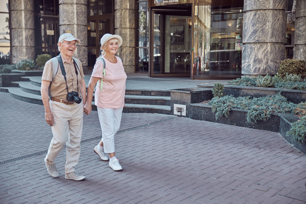 joyous senior tourist couple sauntering joyous senior tourist couple sauntering