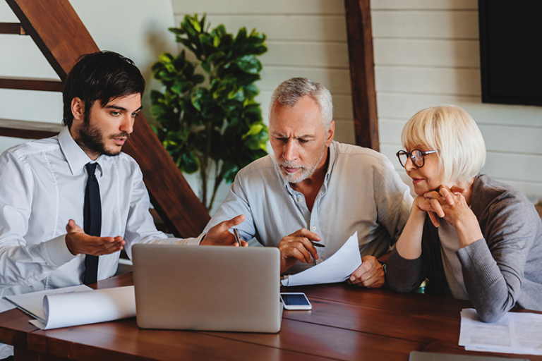 male business agent planning retired couple investments