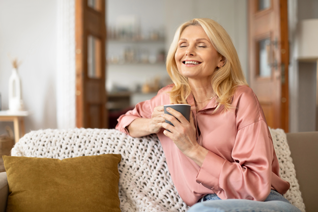 portrait joyful blonde senior woman holding cup portrait joyful blonde senior woman holding cup