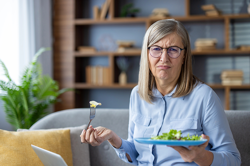 senior woman glasses holds plate senior woman glasses holds plate