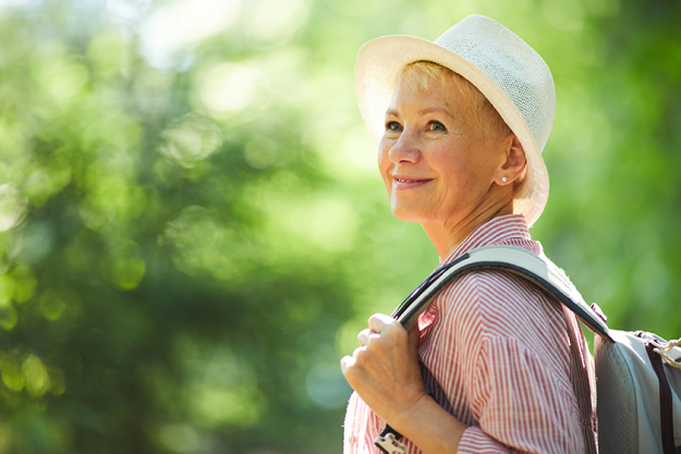 smiling mature woman hat backpack smiling mature woman hat backpack