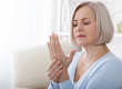 woman massaging her arthritic hand