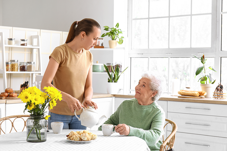 young woman pouring tea cup young woman pouring tea cup