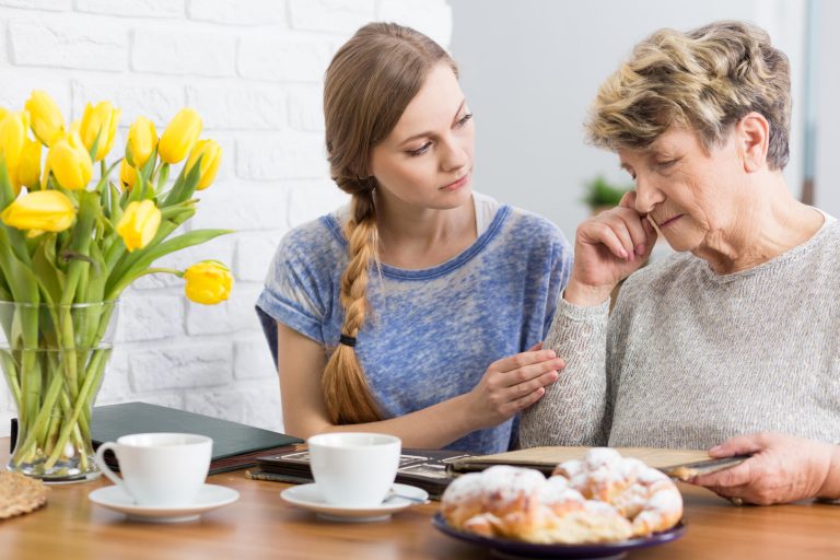 Granma,And,Granddaughter,Sitting,By,The,Table,And,Watching,Old Granma,And,Granddaughter,Sitting,By,The,Table,And,Watching,Old