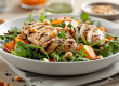 a salad with grilled chicken and a creamy peanut