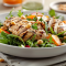 a salad with grilled chicken and a creamy peanut