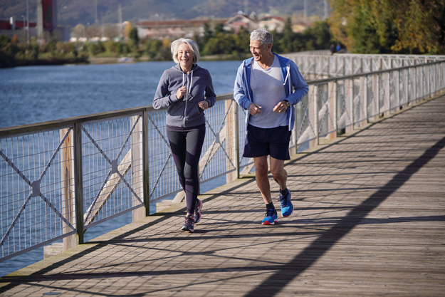 active senior couple jogging together