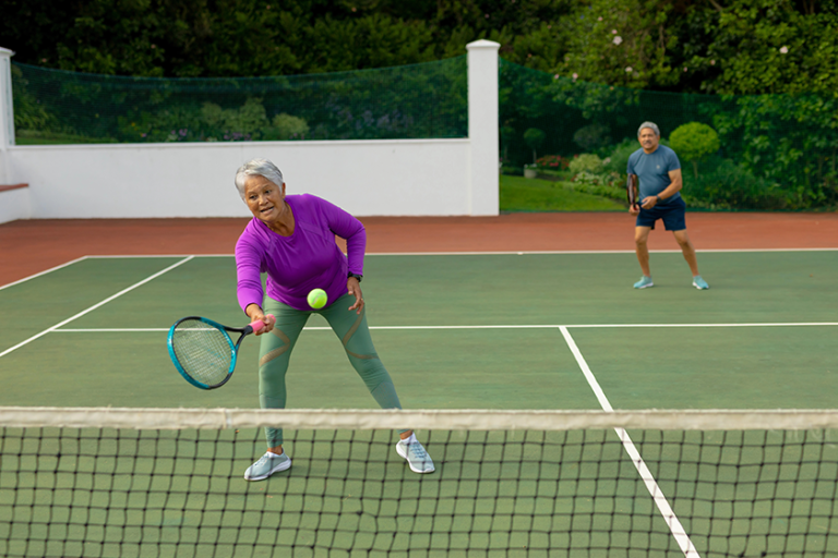 biracial active senior woman senior man playing biracial active senior woman senior man playing