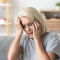 close up aged woman suffering from headache