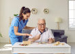 friendly smiling nurse caregiver in geriatric clinic